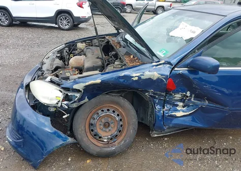 2005 Toyota Camry Le z USA, uszkodzony, nr VIN 4T1BE30KX5U027862